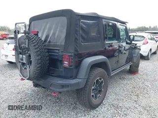 2015 Jeep Wrangler Unlimited Rubicon Hard Rock with VIN 1C4HJWFG6FL757421, listed as a IAAI auction lot 42107514 with 63,997 mi miles and . Bid and sale history available at DreamBid. Image 4.