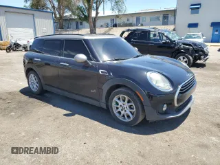 2017 MINI Clubman Cooper with VIN WMWLU1C5XH2C41871, listed as a Copart auction lot 61709154 with 87,570 mi miles and Salvage Title. Bid and sale history available at carsss.com. Image 4.