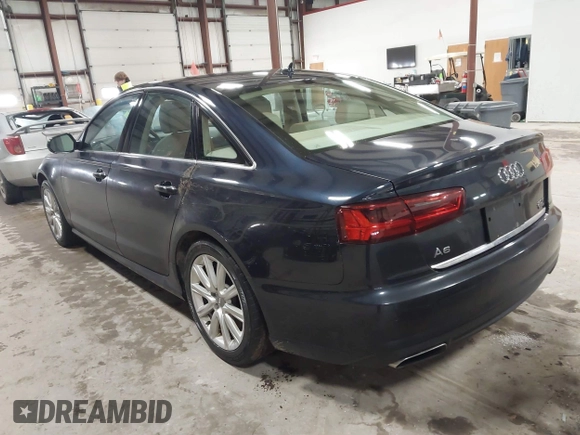 2016 Audi A6 2.0T Premium Plus with VIN WAUGFAFC4GN052293, listed as a IAAI auction lot 41683195 with 85,312 mi miles. Bid and sale history available at carsss.com. Image 3.