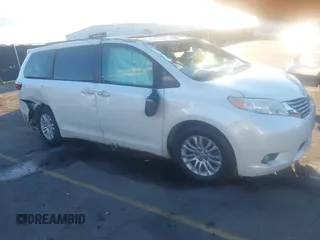 2015 Toyota Sienna XLE with VIN 5TDYK3DC9FS633525, listed as a IAAI auction lot 41249909 with 128,236 mi miles. Bid and sale history available at carsss.com. Image 1.