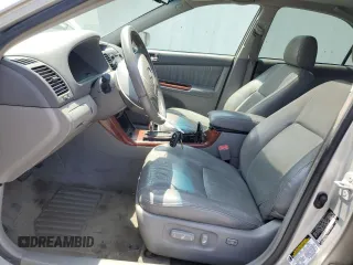 2006 Toyota Camry LE z VIN 4T1BF30K16U630147, wystawiony jako Copart lot #59696815 z przebiegiem 168 727 mil mil oraz Czysty tytuł • Clean title. Historia ofert i sprzedaży dostępna na DreamBid. Obrazek 7.
