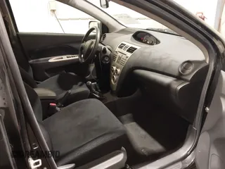 2008 Toyota Yaris with VIN JTDBT903581284634, listed as a IAAI auction lot 40553888 with 180,563 mi miles. Bid and sale history available at carsss.com. Image 5.
