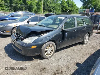 2004 Ford Focus ZTW with VIN 1FAFP35Z84W203676, listed as a Copart auction lot 57272835 with 183,115 mi miles and Salvage title. Bid and sale history available at DreamBid. Image 1.