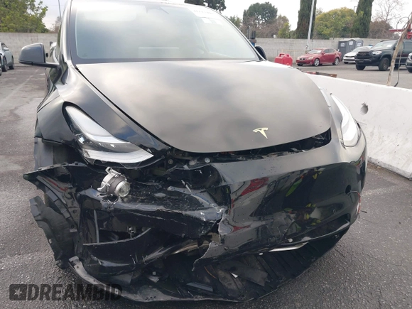 2023 Tesla Model Y Long Range with VIN 7SAYGDEE2PA024032, listed as a IAAI auction lot 41213403 with 23,418 mi miles and . Bid and sale history available at DreamBid. Image 12.