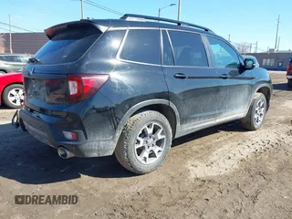 2023 Honda Passport TrailSport with VIN 5FNYF8H67PB042153, listed as a IAAI auction lot 41757909 with 26,810 mi miles and . Bid and sale history available at DreamBid. Image 4.