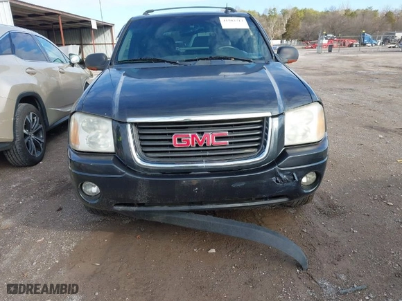 2004 GMC Envoy SLE with VIN 1GKDT13S242130520, listed as a IAAI auction lot 41503717 with 167,426 mi miles. Bid and sale history available at carsss.com. Image 6.