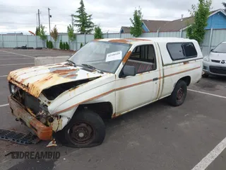 1986 Nissan Hardbody E with VIN JN6ND11S7GW015213, listed as a IAAI auction lot 42588949 with 235,145 mi miles and . Bid and sale history available at DreamBid. Image 2.