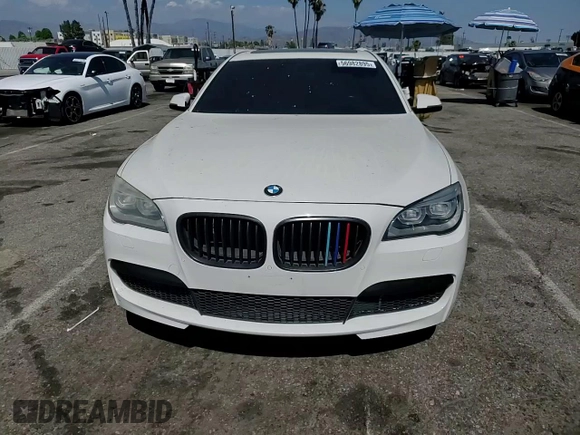 2013 BMW 7 Series 750i with VIN WBAYA8C54DC996412, listed as a Copart auction lot 56982895 with 124,258 mi miles and Salvage title. Bid and sale history available at DreamBid. Image 13.