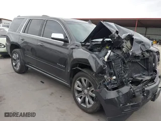 2015 Chevrolet Tahoe LTZ with VIN 1GNSCCKC7FR614886, listed as a IAAI auction lot 41679585 with 104,695 mi miles. Bid and sale history available at carsss.com. Image 1.