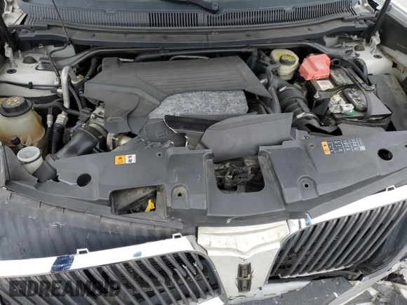 2014 Lincoln MKT EcoBoost with VIN 2LMHJ5ATXEBL50487, listed as a Copart auction lot 46649885 with 187,261 mi miles and Salvage Title. Bid and sale history available at DreamBid. Image 12.