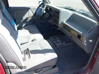 1994 Dodge Dakota z VIN 1B7GG23Y4RS589157, wystawiony jako IAAI lot #41869916 z przebiegiem 122 140 mil mil oraz . Historia ofert i sprzedaży dostępna na DreamBid. Obrazek 5.
