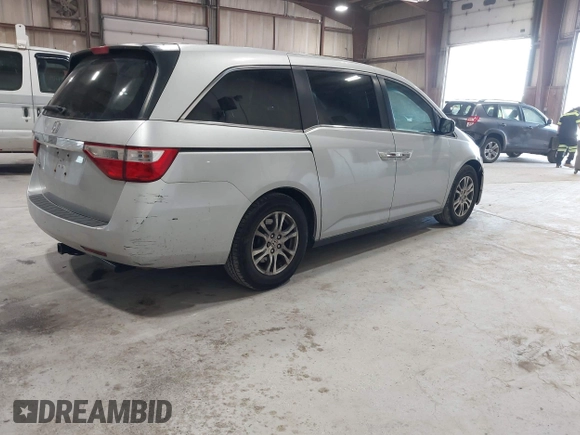 2012 Honda Odyssey EX z VIN 5FNRL5H47CB045705, wystawiony jako IAAI lot #42384430 z przebiegiem 157 598 mil mil oraz . Historia ofert i sprzedaży dostępna na DreamBid. Obrazek 4.