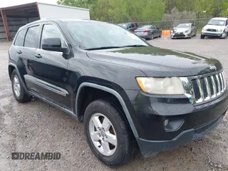 2011 Jeep Grand Cherokee Laredo with VIN 1J4RS4GG7BC569287, listed as a IAAI auction lot 41915092 with 211,148 mi miles and . Bid and sale history available at DreamBid. Image 1.
