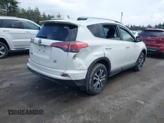 2018 Toyota RAV4 LE with VIN JTMBFREV5JJ738405, listed as a IAAI auction lot 41956145 with 100,593 mi miles and . Bid and sale history available at DreamBid. Image 4.
