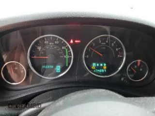 2012 Jeep Wrangler Arctic z VIN 1C4AJWBG9CL123832, wystawiony jako Copart lot #87376204 z przebiegiem 174 097 mil mil oraz Szkoda całkowita • Salvage title. Historia ofert i sprzedaży dostępna na DreamBid. Obrazek 9.
