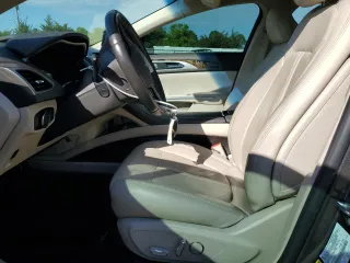 2016 Lincoln MKZ z VIN 3LN6L2JK1GR626675, wystawiony jako Copart lot #56068645 z przebiegiem 94 068 mil mil oraz Szkoda całkowita • Salvage title. Historia ofert i sprzedaży dostępna na DreamBid. Obrazek 7.