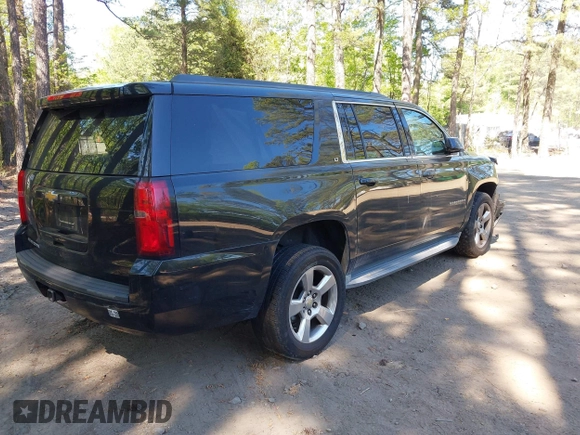 2015 Chevrolet Suburban LT with VIN 1GNSCJKC1FR264255, listed as a IAAI auction lot 42065176 with 115,861 mi miles. Bid and sale history available at carsss.com. Image 4.