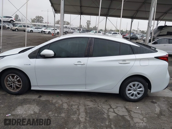 2021 Toyota Prius L Eco with VIN JTDKAMFU6M3150707, listed as a IAAI auction lot 41867272 with 55,499 mi miles and . Bid and sale history available at DreamBid. Image 15.