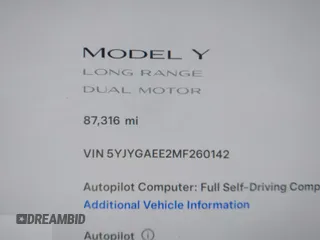 2021 Tesla Model Y Long Range with VIN 5YJYGAEE2MF260142, listed as a IAAI auction lot 41808666 with 87,316 mi miles and . Bid and sale history available at DreamBid. Image 14.