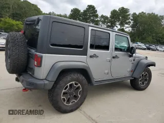 2013 Jeep Wrangler Unlimited Rubicon 10th Anniversary z VIN 1C4HJWFG3DL703331, wystawiony jako Copart lot #70823154 z przebiegiem 148 860 mil mil oraz Szkoda całkowita • Salvage title. Historia ofert i sprzedaży dostępna na DreamBid. Obrazek 3.