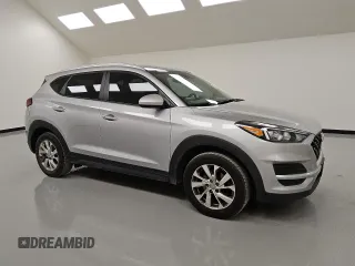 2021 Hyundai Tucson Value with VIN KM8J33A42MU392228, listed as a Copart auction lot 49471815 with 141,637 mi miles and Clean Title. Bid and sale history available at DreamBid. Image 4.