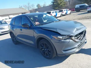 2021 Mazda CX-5 Touring with VIN JM3KFBCM0M0489644, listed as a IAAI auction lot 41756117 with 67,365 mi miles. Bid and sale history available at carsss.com. Image 1.