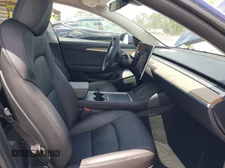 2023 Tesla Model 3 with VIN 5YJ3E1EA0PF658080, listed as a IAAI auction lot 42008846 with 32,301 mi miles and . Bid and sale history available at carsss.com. Image 5.