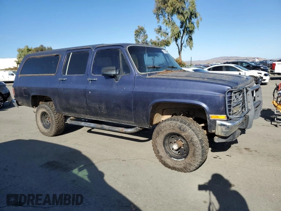 1991 GMC Suburban z VIN 1GKEV16K9MF510909, wystawiony jako Copart lot #81326004 z przebiegiem 216 778 mil mil oraz Tytuł czysty. Historia ofert i sprzedaży dostępna na DreamBid. Obrazek 4.