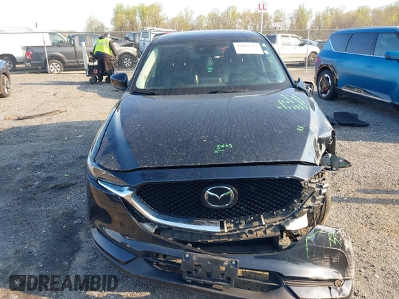 2019 Mazda CX-5 Grand Touring with VIN JM3KFBDM7K0525650, listed as a IAAI auction lot 42032757 with 65,530 mi miles and . Bid and sale history available at DreamBid. Image 13.