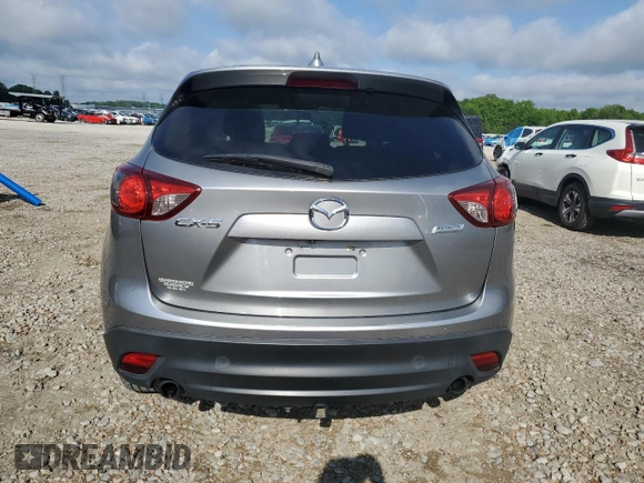 2014 Mazda CX-5 Touring z VIN JM3KE2CY0E0412733, wystawiony jako Copart lot #55803865 z przebiegiem 161 539 mil mil oraz Szkoda całkowita • Salvage title. Historia ofert i sprzedaży dostępna na DreamBid. Obrazek 6.