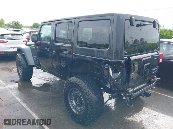 2015 Jeep Wrangler Unlimited Willys Wheeler with VIN 1C4BJWDG4FL687829, listed as a IAAI auction lot 42099147 with 98,969 mi miles and . Bid and sale history available at DreamBid. Image 3.