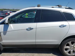 2014 Cadillac SRX Performance Collection with VIN 3GYFNFE35ES582897, listed as a IAAI auction lot 41978361 with 144,116 mi miles and . Bid and sale history available at DreamBid. Image 14.