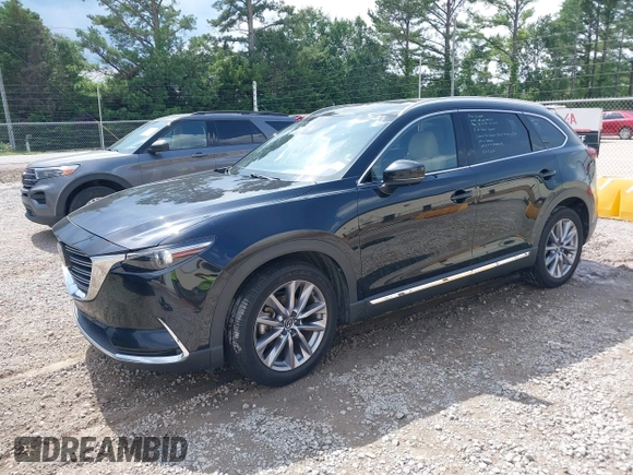 2022 Mazda CX-9 Grand Touring with VIN JM3TCBDYXN0627657, listed as a IAAI auction lot 42498856 with 61,044 mi miles and . Bid and sale history available at DreamBid. Image 2.