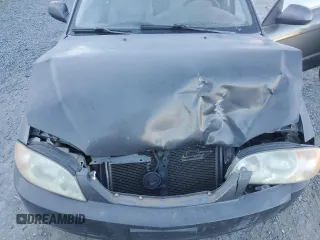 2003 Kia Spectra with VIN KNAFB121235248271, listed as a Copart auction lot 82426614 with 151,347 mi miles and Salvage Title. Bid and sale history available at DreamBid. Image 11.