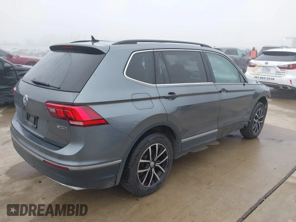 2021 Volkswagen Tiguan SE with VIN 3VV2B7AX8MM143189, listed as a IAAI auction lot 41646843 with 56,672 mi miles and . Bid and sale history available at DreamBid. Image 4.