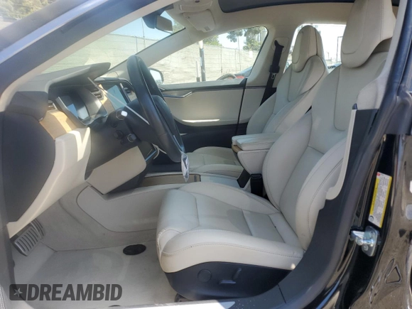 2019 Tesla Model S 100D with VIN 5YJSA1E42KF331240, listed as a Copart auction lot 54713975 with 43,940 mi miles and Salvage title. Bid and sale history available at DreamBid. Image 7.