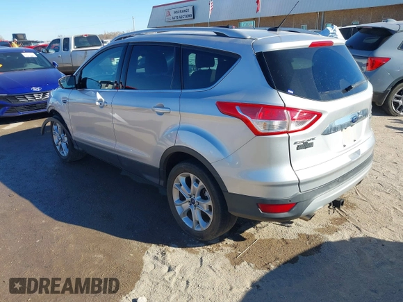2014 Ford Escape Titanium with VIN 1FMCU0JX7EUC59643, listed as a IAAI auction lot 41082952 with 143,899 mi miles. Bid and sale history available at carsss.com. Image 3.
