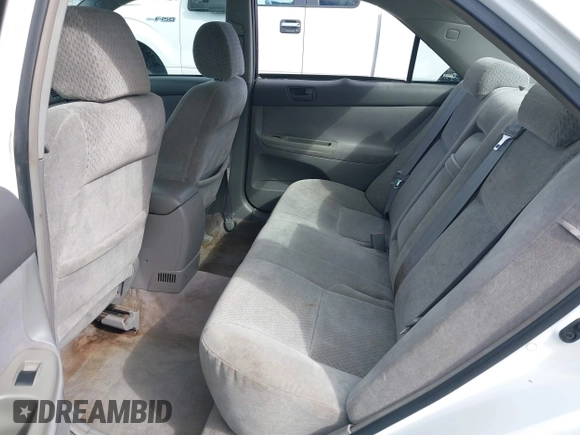 2002 Toyota Camry XLE z VIN 4T1BF30KX2U035422, wystawiony jako IAAI lot #41762363 z przebiegiem 220 465 mil mil oraz . Historia ofert i sprzedaży dostępna na DreamBid. Obrazek 8.
