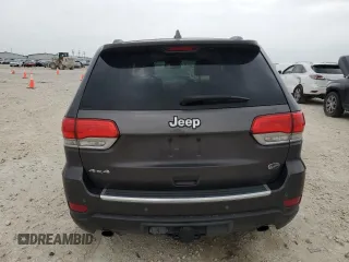 2014 Jeep Grand Cherokee Overland with VIN 1C4RJFCG9EC572237, listed as a Copart auction lot 53864865 with 90,657 mi miles and Salvage Title. Bid and sale history available at DreamBid. Image 6.