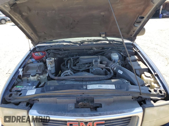 2001 GMC Jimmy SLE Rental Fleet z VIN 1GKDT13W212108144, wystawiony jako Copart lot #58753865 z przebiegiem 254 402 mil mil oraz Szkoda całkowita • Salvage title. Historia ofert i sprzedaży dostępna na DreamBid. Obrazek 12.