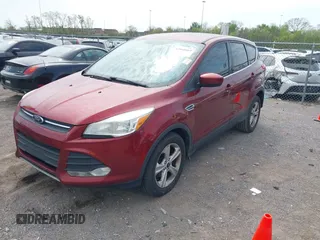 2014 Ford Escape SE with VIN 1FMCU0GX2EUB60526, listed as a IAAI auction lot 42060469 with 128,796 mi miles. Bid and sale history available at carsss.com. Image 2.