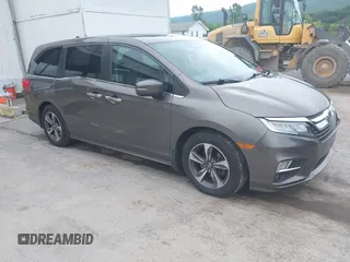 2018 Honda Odyssey Touring with VIN 5FNRL6H89JB057148, listed as a IAAI auction lot 42511909 with 166,438 mi miles and . Bid and sale history available at DreamBid. Image 1.