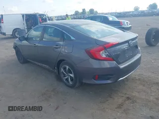 2020 Honda Civic LX with VIN 2HGFC2F65LH505932, listed as a IAAI auction lot 40046863 with 59,768 mi miles and . Bid and sale history available at DreamBid. Image 3.