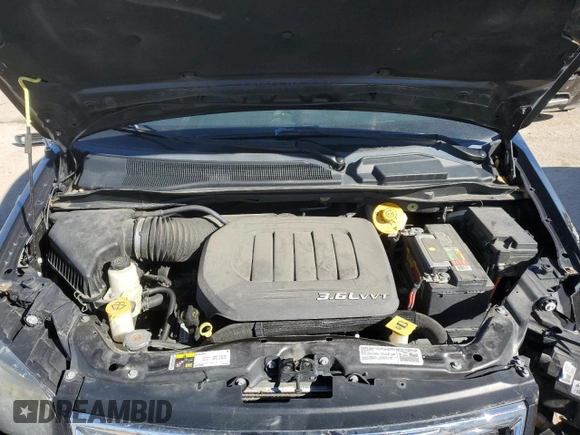2014 Chrysler Town & Country S with VIN 2C4RC1HG7ER191693, listed as a Copart auction lot 75534013 with 136,231 mi miles and Salvage Title. Bid and sale history available at DreamBid. Image 12.
