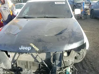 2015 Jeep Grand Cherokee SRT with VIN 1C4RJFDJ8FC687469, listed as a Copart auction lot 85270104 with 0 mi miles and Salvage Title. Bid and sale history available at carsss.com. Image 12.