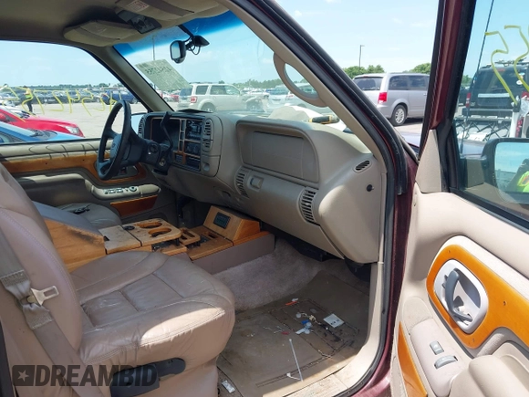 1999 Chevrolet Suburban with VIN 1GBFK16R5XJ335005, listed as a IAAI auction lot 42542755 with 200,599 mi miles and . Bid and sale history available at DreamBid. Image 5.