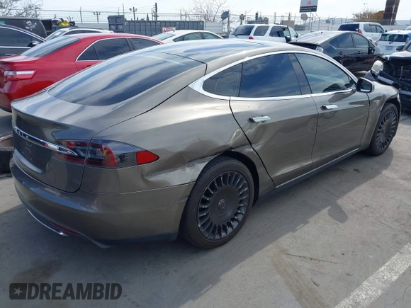 2015 Tesla Model S 85 with VIN 5YJSA1E14FF120455, listed as a IAAI auction lot 42053306 with 62,817 mi miles and . Bid and sale history available at DreamBid. Image 4.
