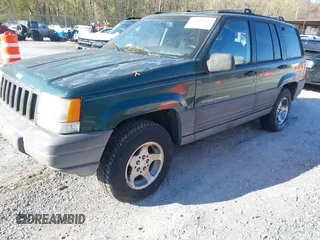 1996 Jeep Grand Cherokee with VIN 1J4EZ58Y7TC128428, listed as a IAAI auction lot 42050443 with 241,591 mi miles and . Bid and sale history available at DreamBid. Image 2.