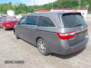 2012 Honda Odyssey EX-L with VIN 5FNRL5H68CB060487, listed as a IAAI auction lot 42176223 with 234,078 mi miles and . Bid and sale history available at DreamBid. Image 3.
