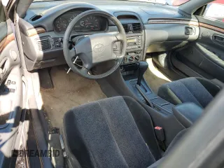 1999 Toyota Solara SE with VIN 2T1CF22P6XC135534, listed as a Copart auction lot 61900395 with 177,838 mi miles and Salvage title. Bid and sale history available at DreamBid. Image 8.